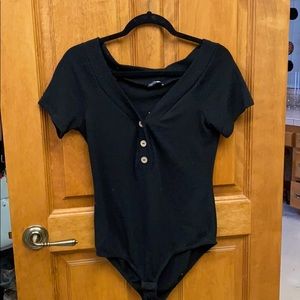 A  Black FashionNova Body Suit